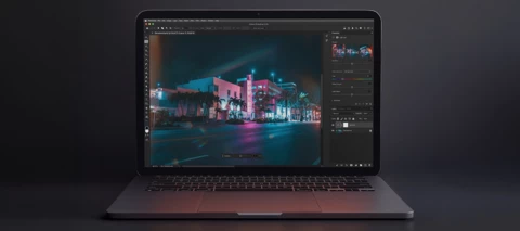 A modern laptop with the latest version of Photoshop open