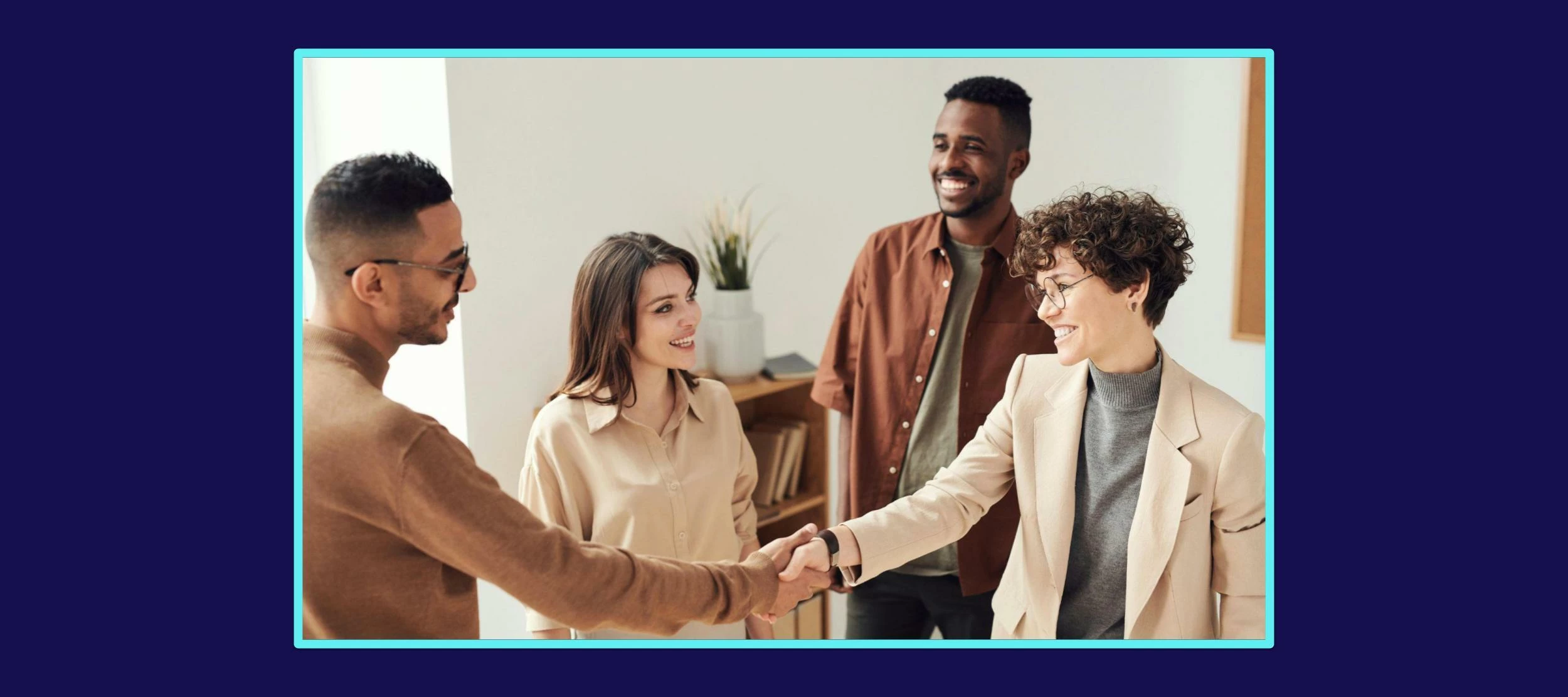 A picture of four people looking at each other; two people offering each other a handshake
