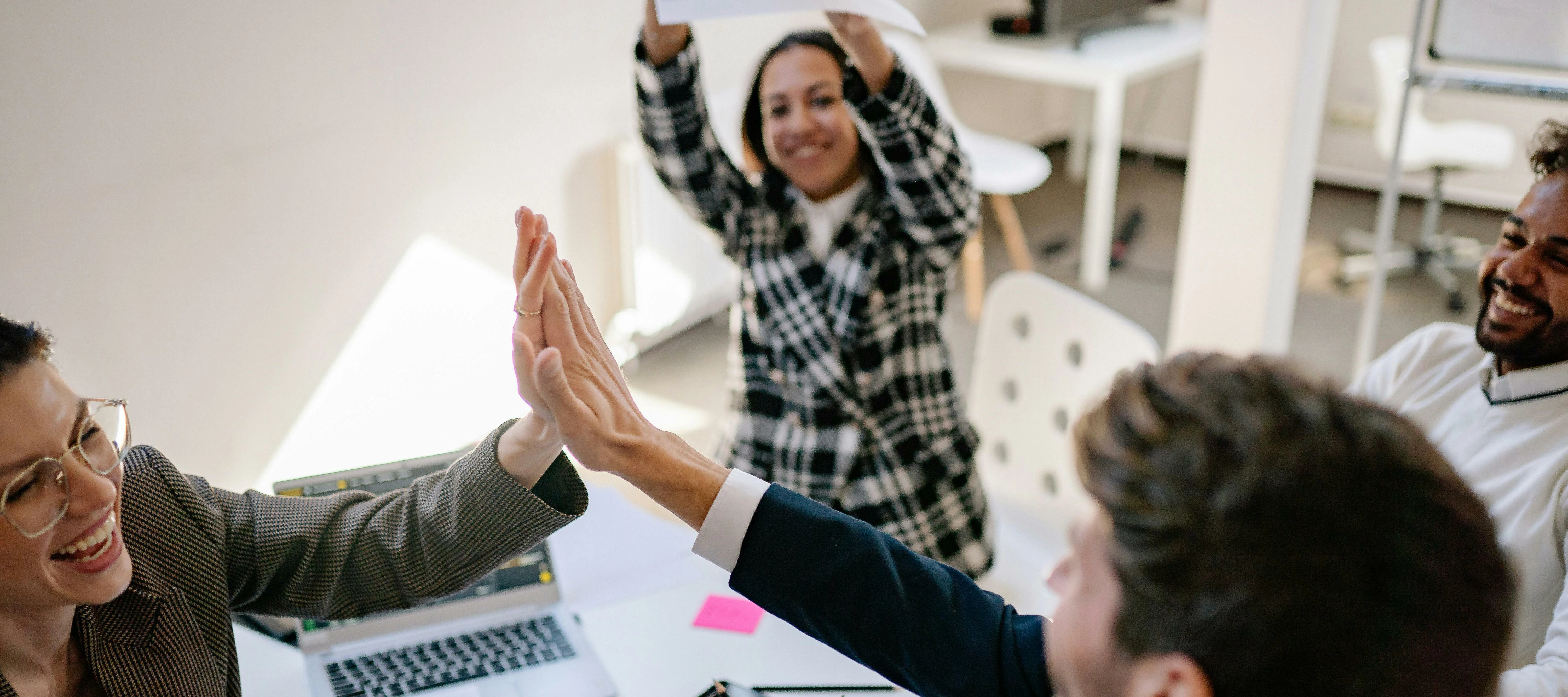 Happy Business Meeting with people high-fiving