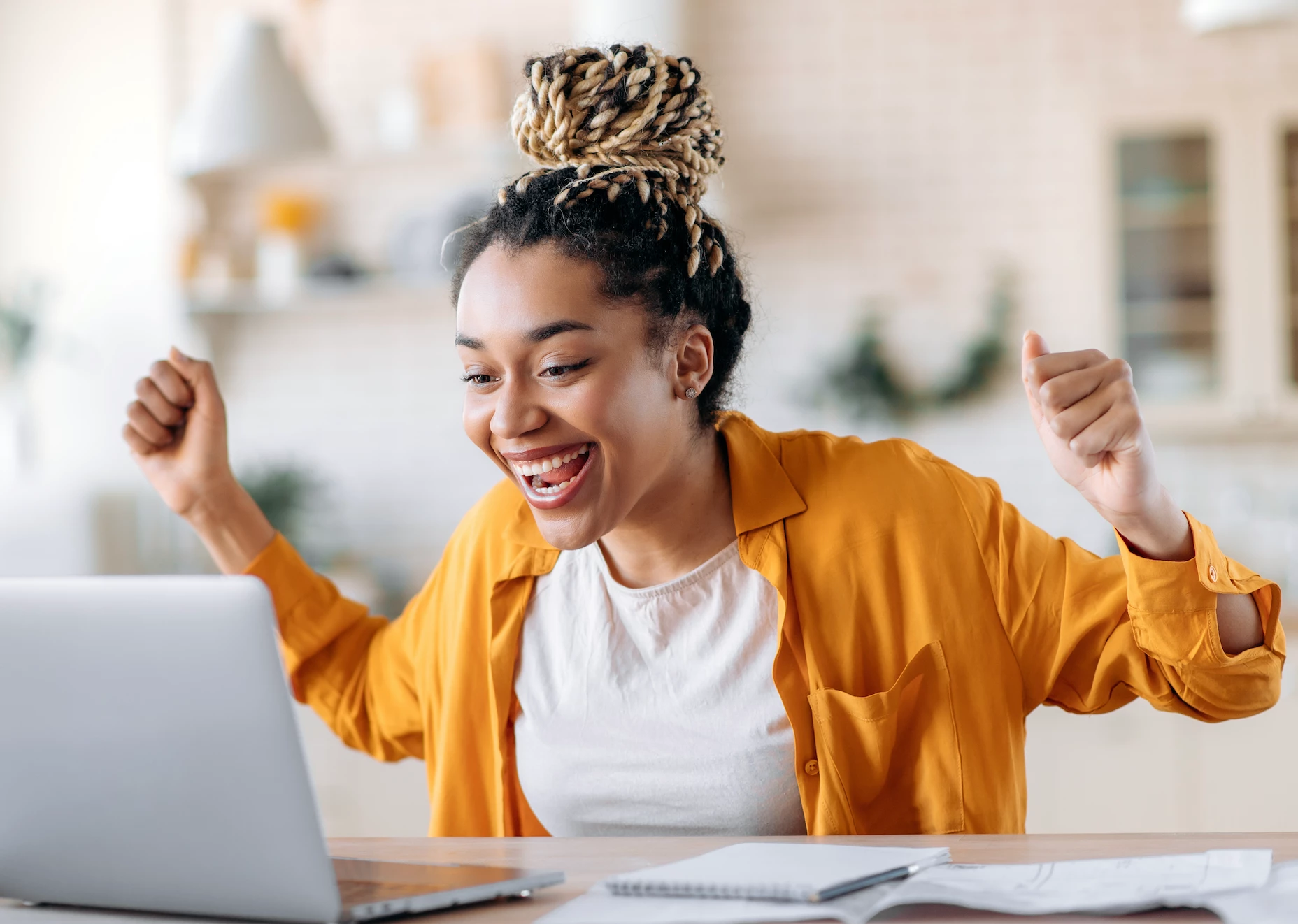 Excited user at laptop