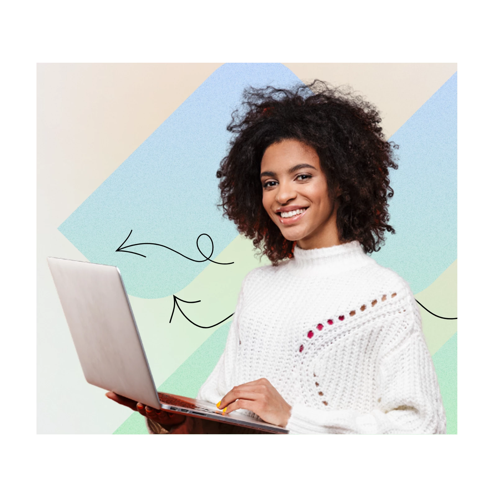 A woman smiling while holding a laptop
